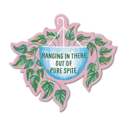 Hanging in there out of pure spite sticker with leafy floral illustration.